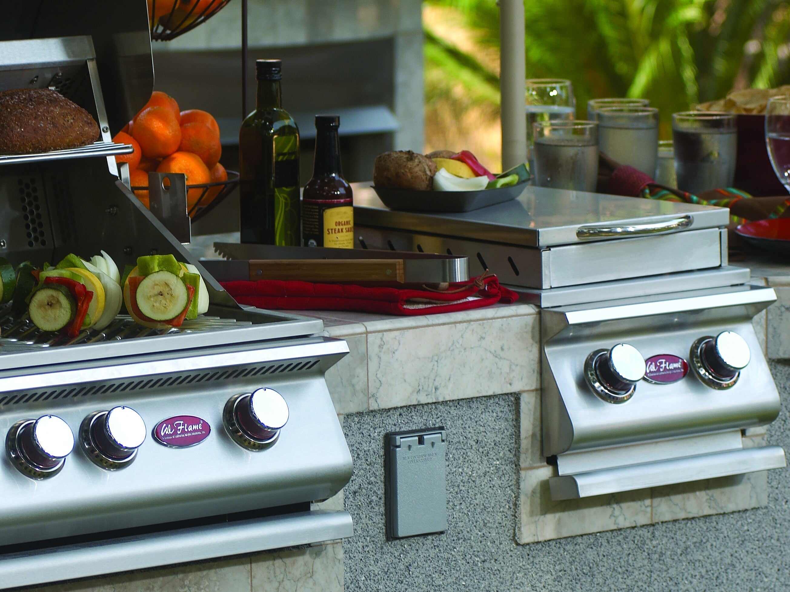 Flames rising off a Cal Flame grill, Hot Off the Grill newsletter