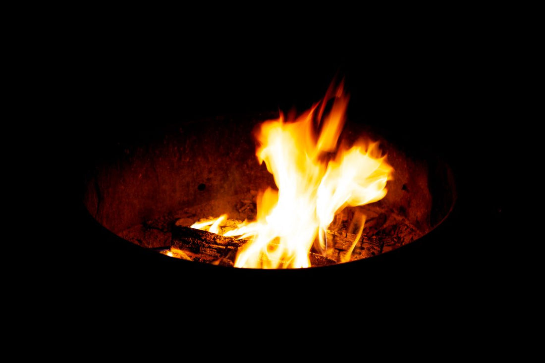Fire burning in a round backyard fire pit