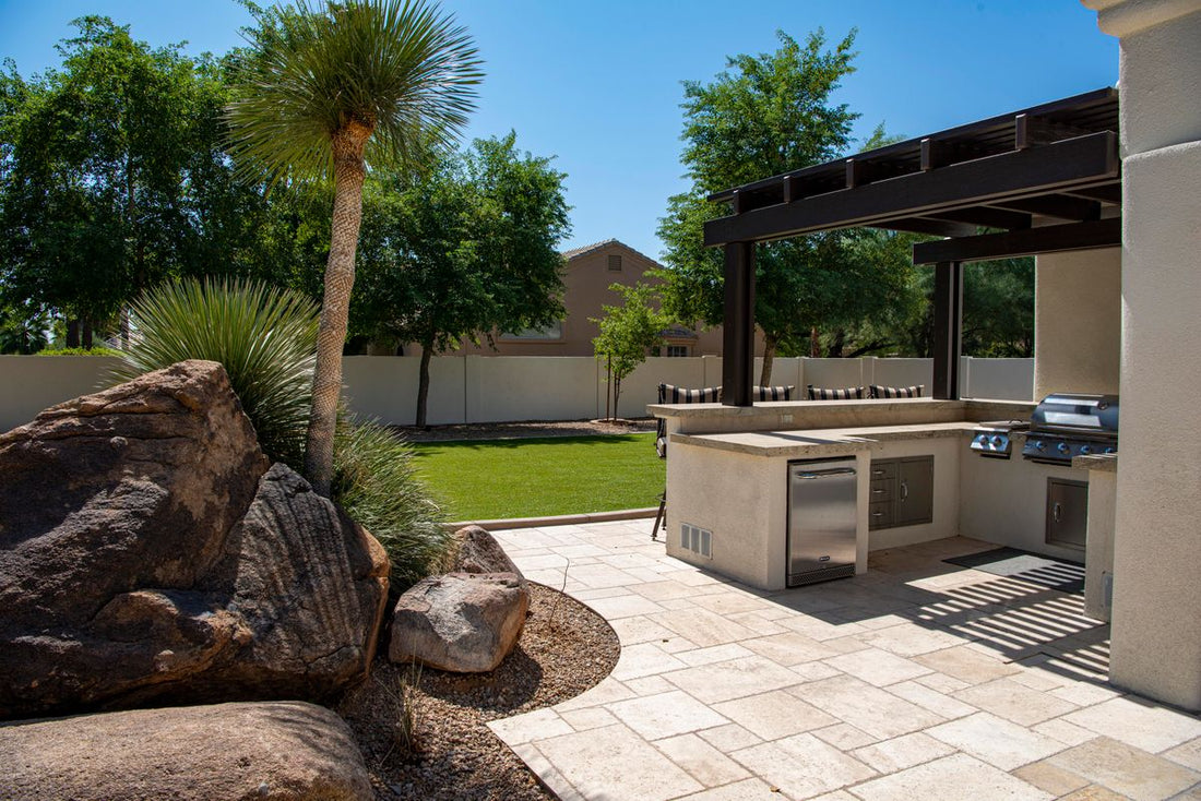 Modern outdoor kitchen with built-in grill on a patio