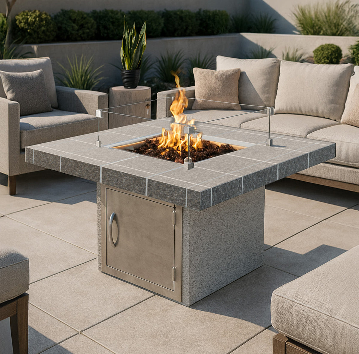 Cal Flame Mesa gas fire pit lit on a patio at dusk