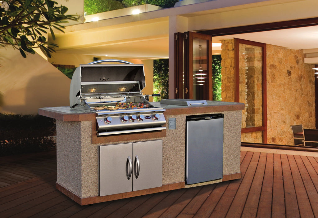 Cal Flame Bel Air Q outdoor kitchen island beside an open patio door