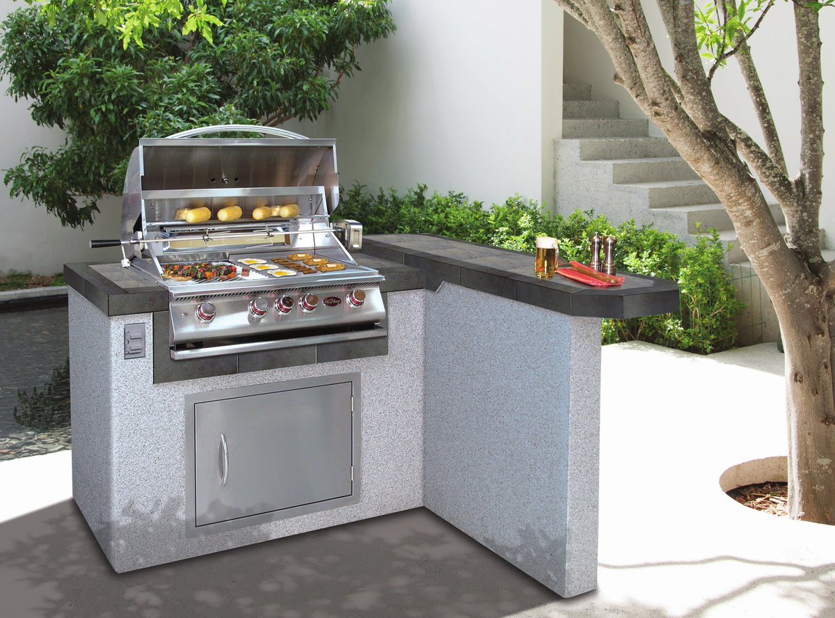 Cal Flame Maui Q outdoor kitchen island in a landscaped backyard